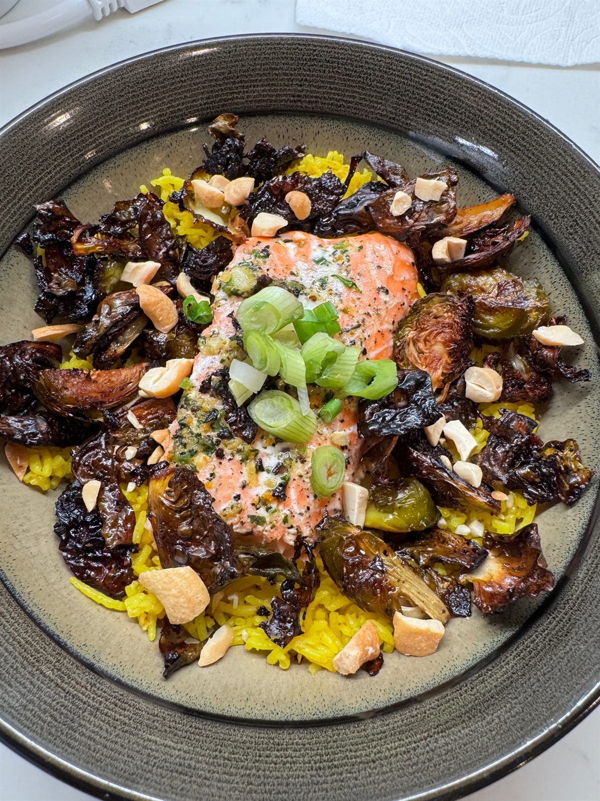 Roasted brussels sprouts and mushrooms over a golden purée with almonds and scallion